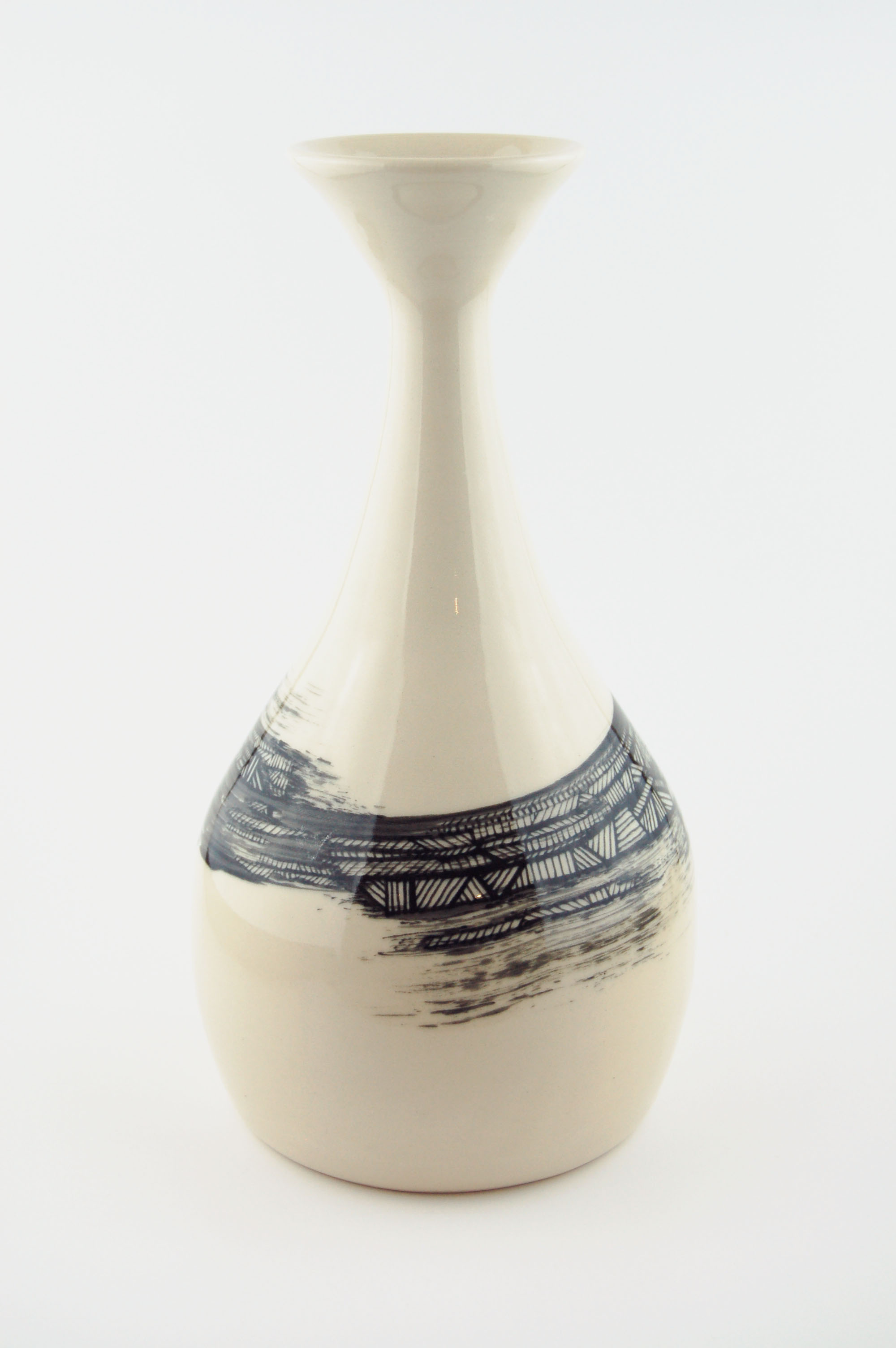 Ceramic vase with black lines on off-white clay